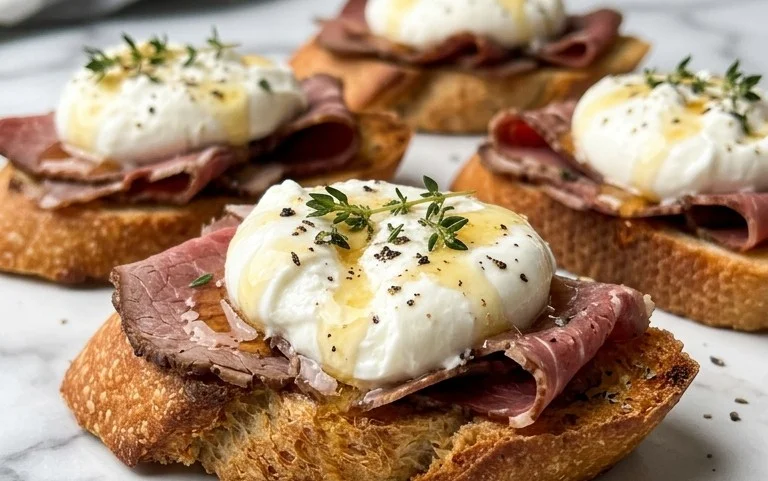 Beef Prosciutto Crostini with Burrata and Lemon Honey Drizzle